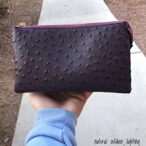 Textured purple purse/wristlet with gold accents